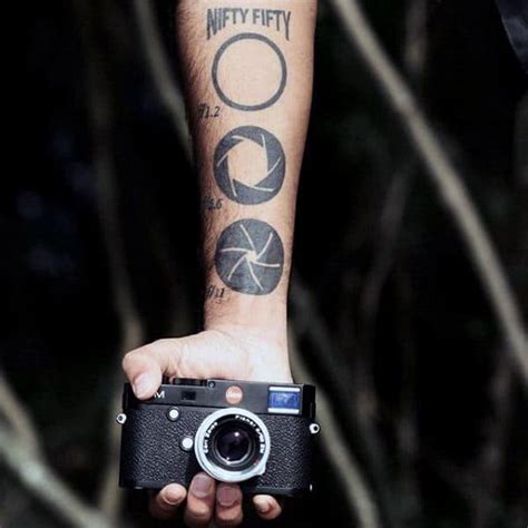 camera lens tattoo